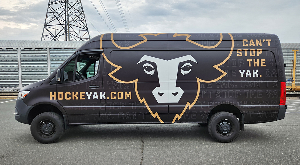 Custom graphics on a van of a yak for HockeyYak