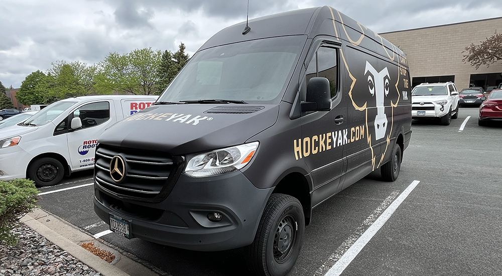 Custom graphics on a van of a yak for HockeyYak