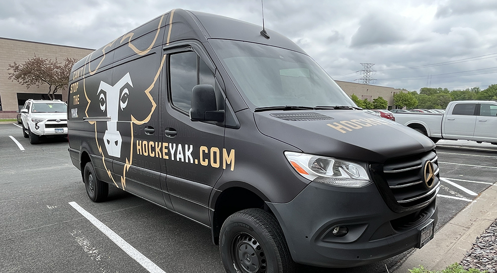 Custom graphics on a van of a yak for HockeyYak