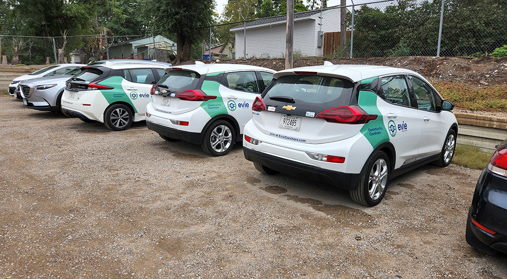 White cars wrapped with custom branding