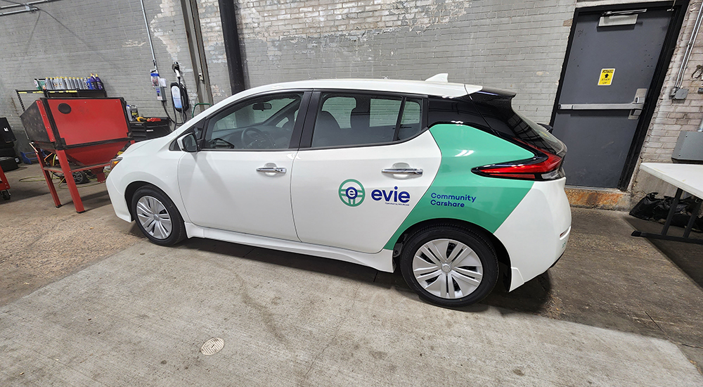 White cars wrapped with custom branding