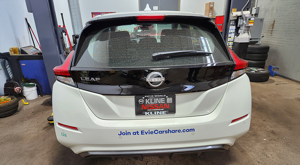 White cars wrapped with custom branding