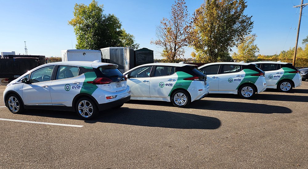 White cars wrapped with custom branding