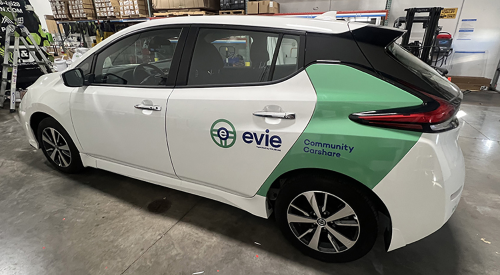 White cars wrapped with custom branding