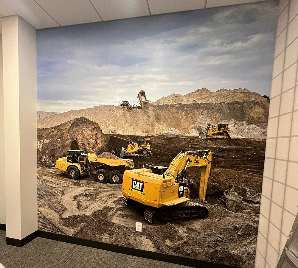 Wall graphic of excavation trucks and machines