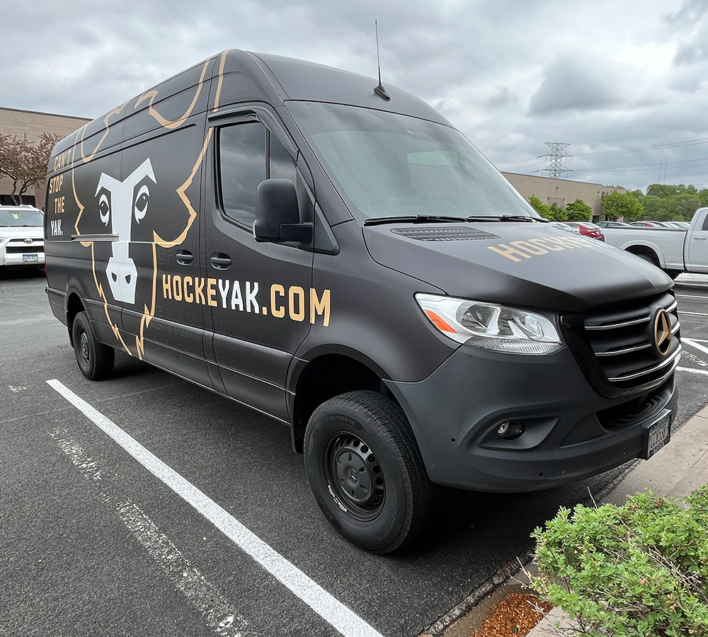 Custom graphics on a van of a yak for HockeyYak