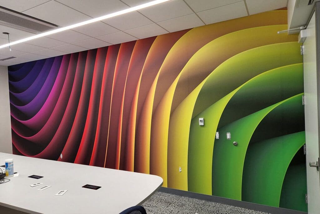 Meeting room wall wrapped in bright and colorful vinyl.