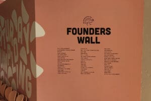 Saturday Dumpling list of founders' names on branded vinyl wall
