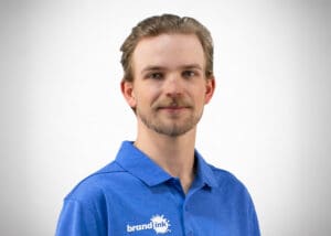 Professional head shot of James Aho, graphics installer at Brand Ink