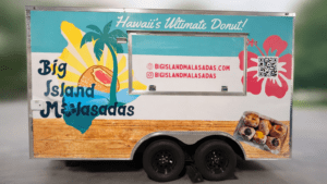 Big Island Malasadas food trailer wrap with colorful Hawaii-themed graphics installed by Brand Ink