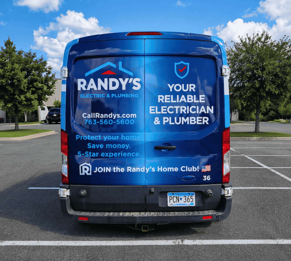 Back of a Randy's Electric & Plumbing Ford Transit wrapped by Brand ink