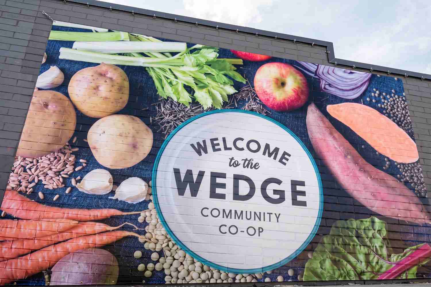 Large-format exterior wall graphic installed by Brand Ink for Wedge Community Co-op in Minneapolis, Minnesota.